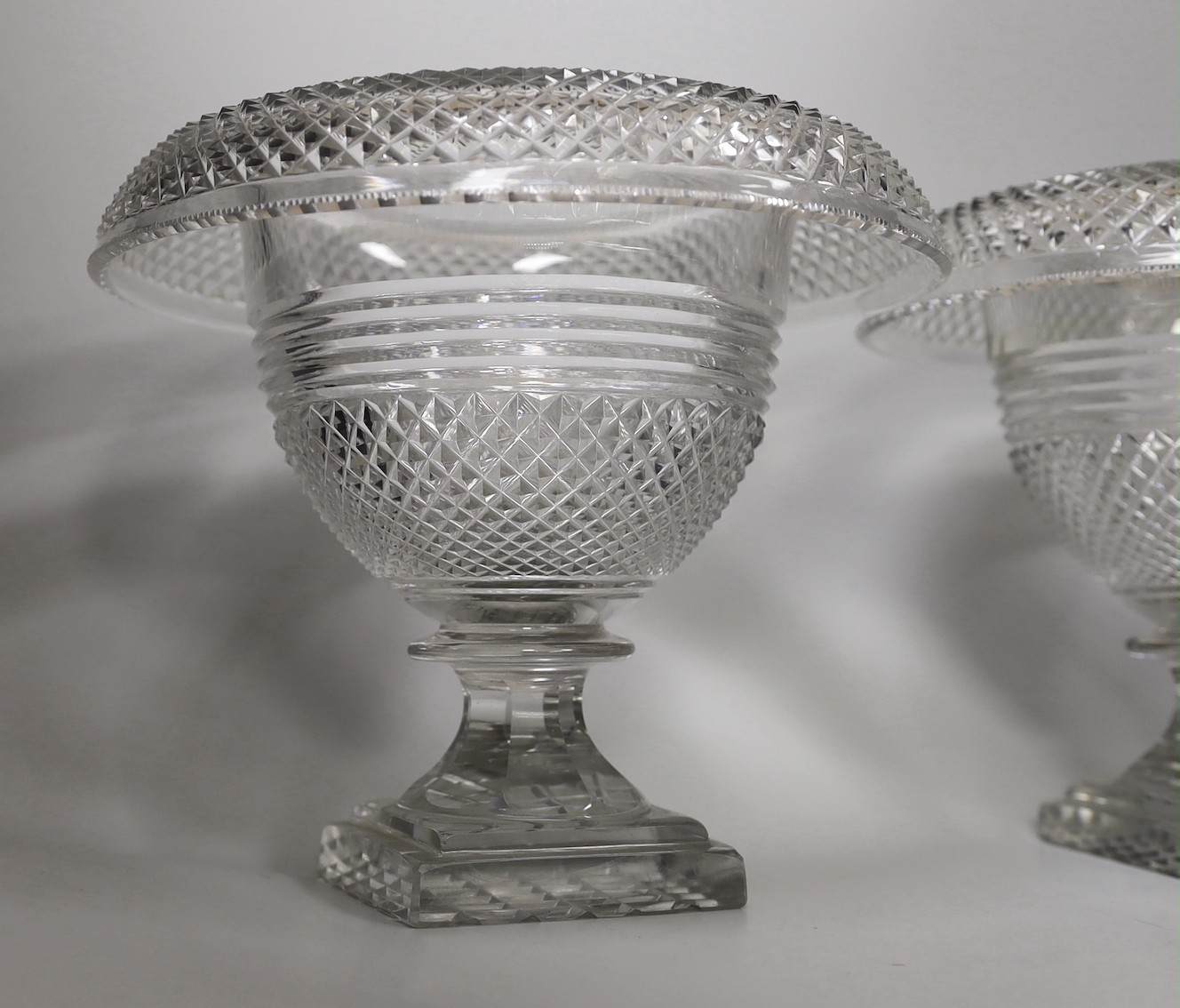 A pair of Georgian cut glass turnover rim pedestal dishes, 22cm tall